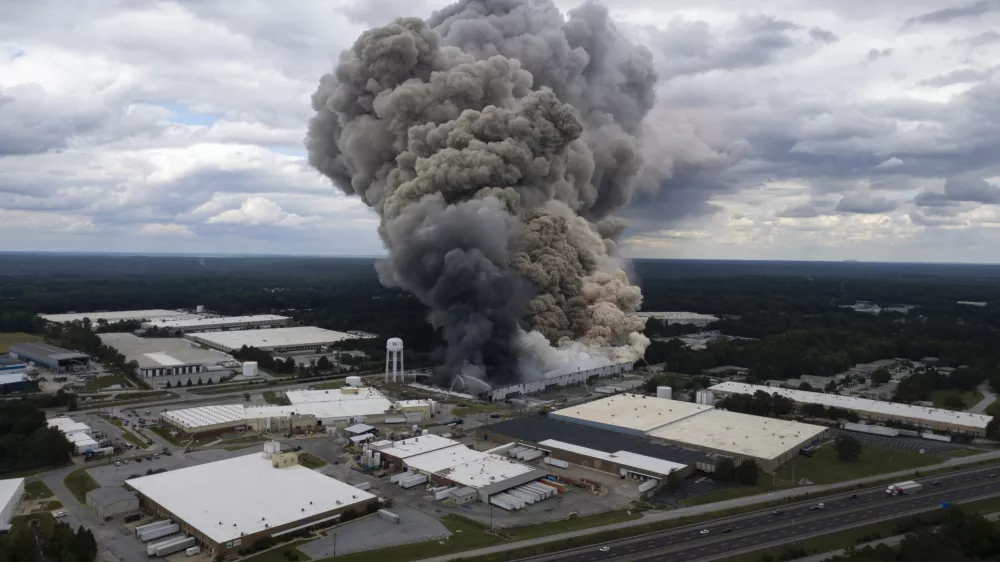 Smoke billows from a fire at the BioLab facility in Conyers, Ga., Sunday, Sept. 29, 2024. (Ben Gray/Atlanta Journal-Constitution via AP)