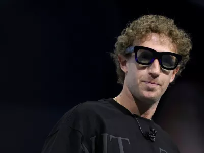 Meta CEO Mark Zuckerberg tries on Orion AR glasses at the Meta Connect annual event at the company's headquarters in Menlo Park, California, U.S., September 25, 2024. REUTERS/Manuel Orbegozo  TPX IMAGES OF THE DAY