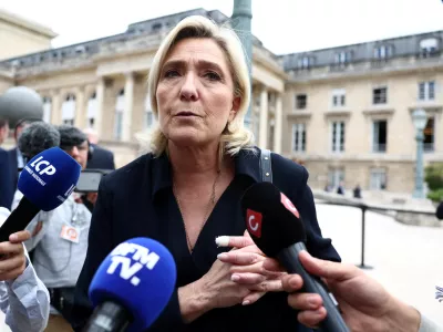 FILE PHOTO: French far-right leader Marine Le Pen, member of parliament of the Rassemblement National (National Rally - RN) party, talks to journalists at the National Assembly in Paris after the second round of the early French parliamentary elections, France, July 10, 2024. REUTERS/Yara Nardi/File Photo