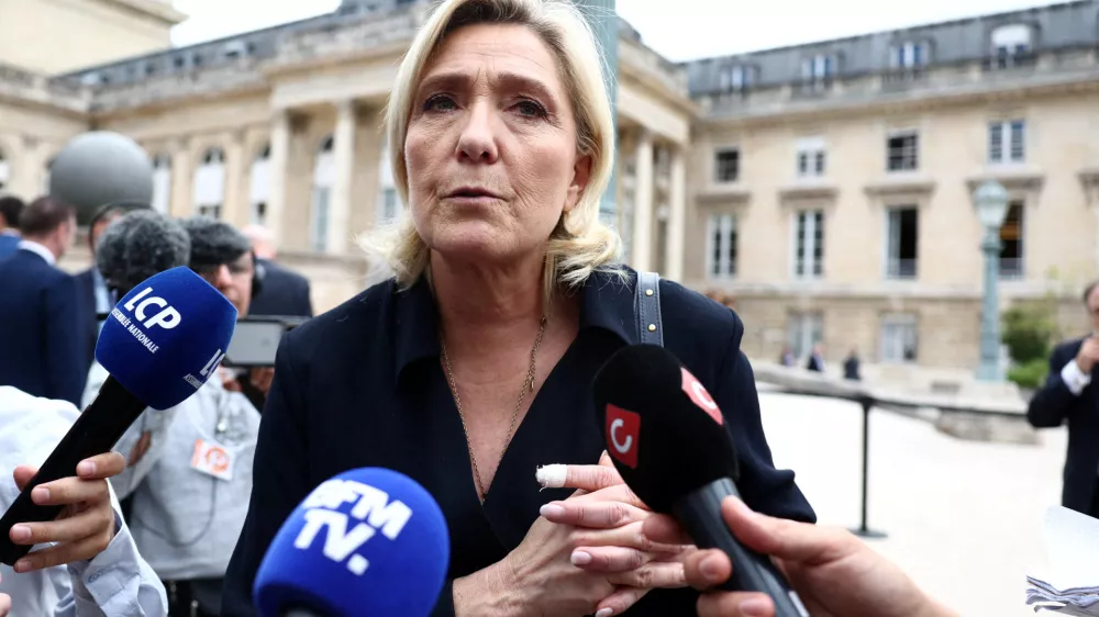 FILE PHOTO: French far-right leader Marine Le Pen, member of parliament of the Rassemblement National (National Rally - RN) party, talks to journalists at the National Assembly in Paris after the second round of the early French parliamentary elections, France, July 10, 2024. REUTERS/Yara Nardi/File Photo