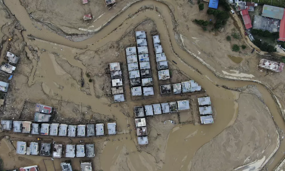 In this aerial image of the Kathmandu valley, a locality is swamped in mud in Kathmandu, Nepal, Monday, Sept. 30, 2024 in the aftermath of a flood caused by heavy rains. (AP Photo/Gopen Rai)