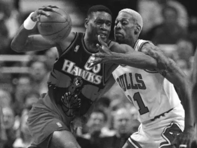 FILE - The Atlanta Hawks' Dikembe Mutombo, left, drives to the hoop against the Chicago Bulls' Dennis Rodman during the second quarter of their playoff game Thursday, May 8, 1997, in Chicago. (AP Photo/Michael S. Green, File)