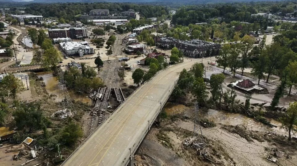 Debris is seen in the aftermath of Hurricane Helene, Monday, Sept. 30, 2024, in Asheville, N.C. (AP Photo/Mike Stewart)