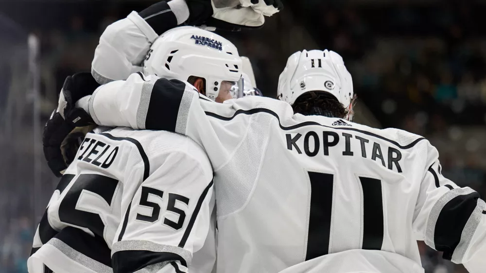 Apr 4, 2024; San Jose, California, USA; Los Angeles Kings center Anze Kopitar (11) and right wing Quinton Byfield (55) celebrate after a goal scored against the San Jose Sharks during the first period at SAP Center at San Jose. Mandatory Credit: Robert Edwards-USA TODAY Sports