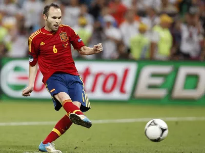 Spain's Andres Iniesta scores his penalty shootout during the Euro 2012 soccer championship semifinal match between Spain and Portugal in Donetsk, Ukraine, Thursday, June 28, 2012. (AP Photo/Jon Super)