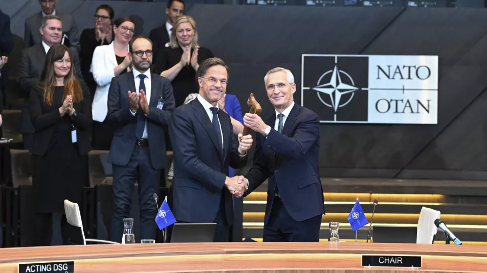 The outgoing NATO Secretary General Jens Stoltenberg, right, welcomes the new NATO Secretary General Mark Rutte during a handover ceremony at NATO headquarters in Brussels, Belgium, Tuesday, Oct. 1, 2024. (AP Photo/Harry Nakos)