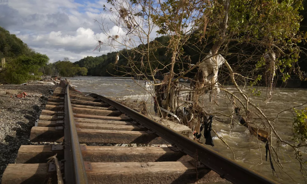 Train tracks washed out during Hurricane Helene run along the French Broad River, Tuesday, Oct. 1, 2024, in Marshall, N.C. (AP Photo/Jeff Roberson)