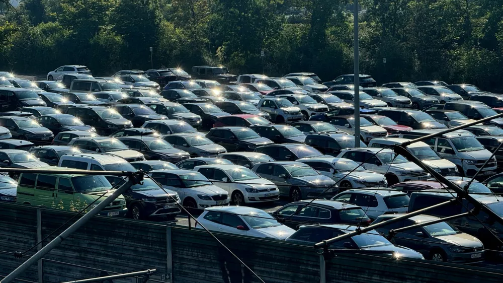 FILE PHOTO: FILE PHOTO: Cars are parked near the power station of the Volkswagen plant in Wolfsburg, Germany, September 4, 2024.  REUTERS/Stephane Nitschke/File Photo/File Photo