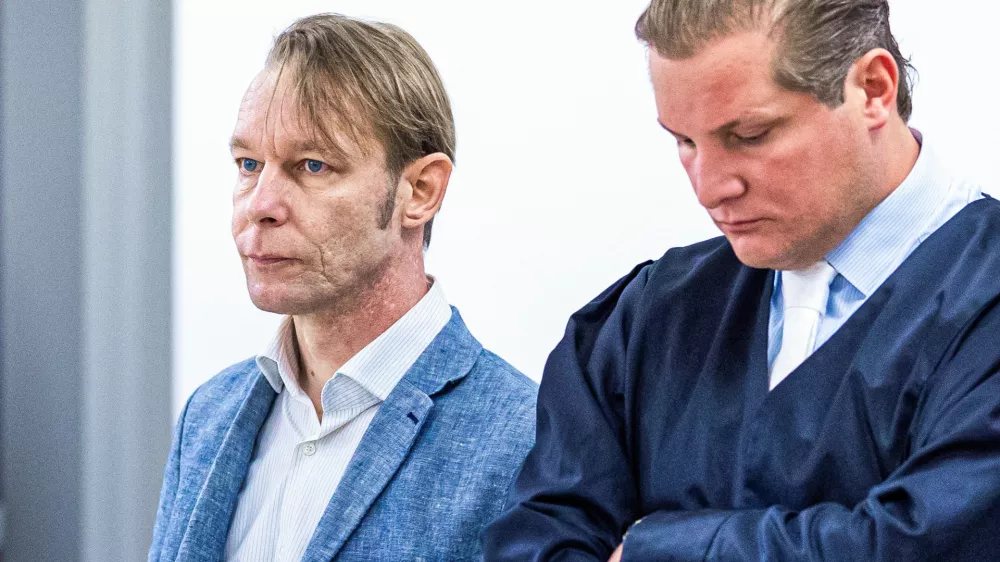 A man, who is a suspect in the disappearance of British toddler Madeleine McCann in Portugal, stands next to his lawyer Friedrich Fuelscher at his trial on unrelated sexual assault charges in Braunschweig, Germany, October 2, 2024. Christian B., is charged with three counts of aggravated rape and two counts of sexual abuse of children in Portugal between June 2007 and December 2000.   Moritz Frankenberg/Pool via REUTERS