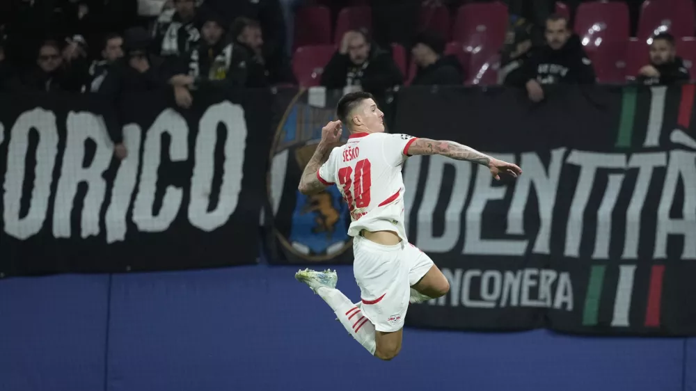 Leipzig's Benjamin Sesko celebrates after he scored during the UEFA Champions League opening phase soccer match between Leipzig and Juventus in Leipzig, Germany, Wednesday, Oct. 2, 2024.(AP Photo/Ebrahim Noroozi)