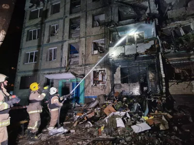 03 October 2024, Ukraine, Kharkiv: Firefighters extinguish the fire in a residential building that was damaged by a Russian missile attack. Photo: ---/Ukrinform/dpa