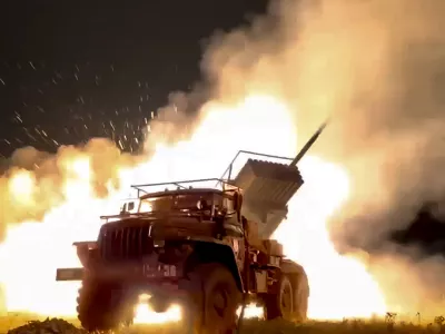 In this photo taken from video released by Russian Defense Ministry Press Service on Sunday, Oct. 6, 2024, a Russian Army "Grad" self-propelled 122 mm multiple rocket launcher fires rockets toward Ukrainian position at an undisclosed location. (Russian Defense Ministry Press Service photo via AP)