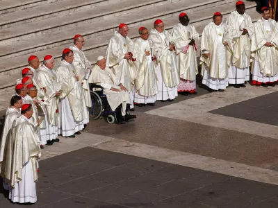 FILE PHOTO: Pope Francis meets newly elevated cardinals at the mass to open the Synod of Bishops in St Peter's Square at the Vatican, October 4, 2023. REUTERS/Guglielmo Mangiapane/File Photo