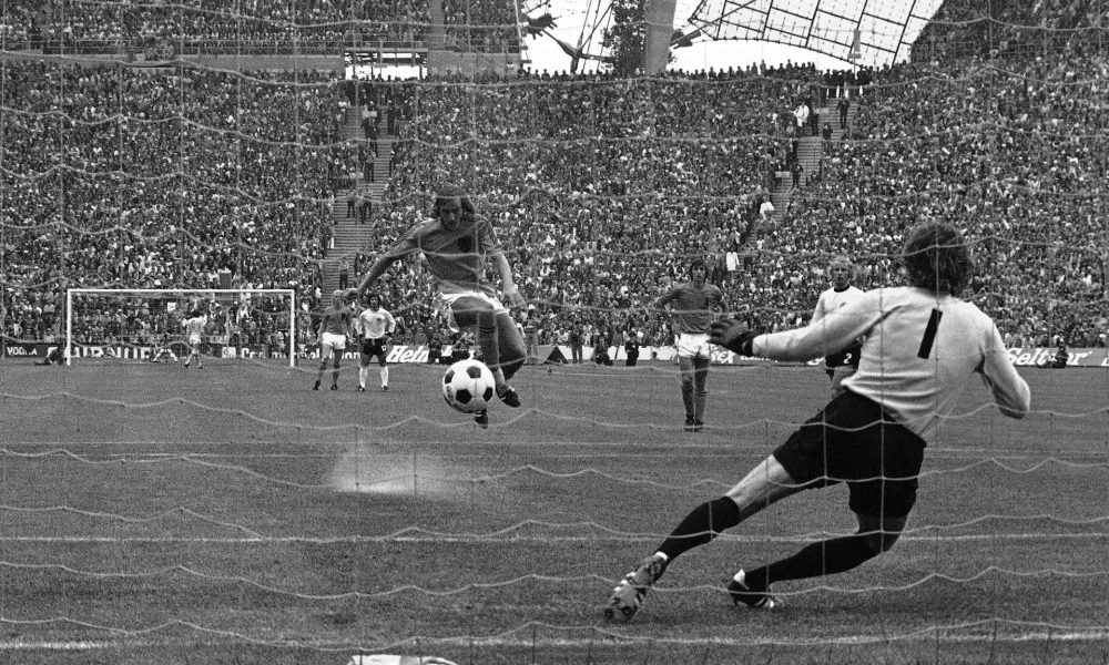 FILE - Johan Neeskens of the Netherlands scores from the penalty spot past West Germany's Sepp Maier to give his team a 1-0 lead in the World Cup final soccer match in Munich, West Germany, July 7, 1974. (AP Photo, File)