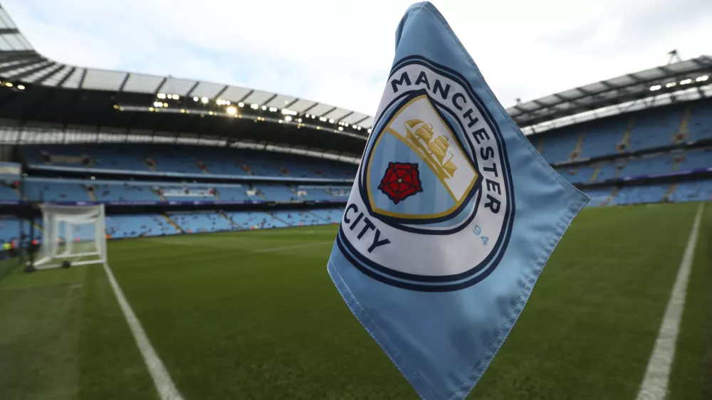 FILE - The club logo decorates a corner flag before the English Premier League soccer match between Manchester City and Newcastle United at the Etihad Stadium in Manchester, England, Saturday, Sept. 1, 2018. (AP Photo/Jon Super, File)