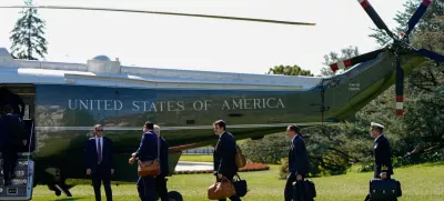 Staff boards Marine One before U.S. President Joe Biden departs for Wisconsin from the South Lawn of the White House in Washington, U.S., October 8, 2024. REUTERS/Elizabeth Frantz