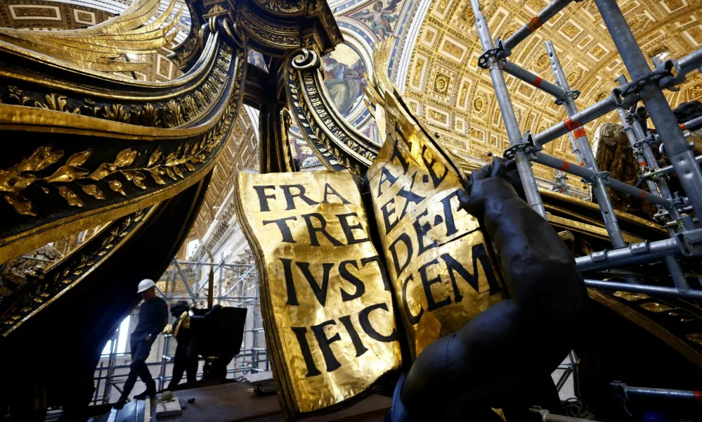 General view of a detail of the baroque sculpted bronze canopy by Gian Lorenzo Bernini over the high altar of St. Peter's Basilica as it undergoes restoration at the Vatican, October 8, 2024. REUTERS/Guglielmo Mangiapane