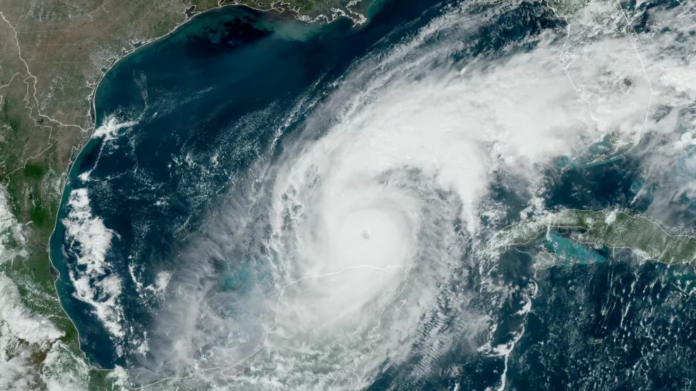 FILE PHOTO: A satellite image shows Hurricane Milton progressing before its expected landfall in Florida, in the Gulf of Mexico October 8, 2024.  CIRA/NOAA/Handout via REUTERS  THIS IMAGE HAS BEEN SUPPLIED BY A THIRD PARTY./File Photo