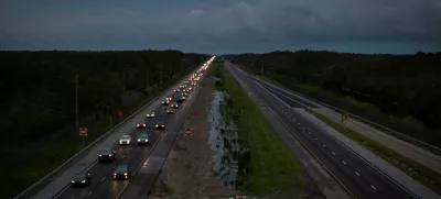 A drone view shows commuters driving east from the west coast ahead of the arrival of Hurricane Milton, at mile marker 51 on Interstate 75, Florida, U.S., October 8, 2024. REUTERS/Marco Bello