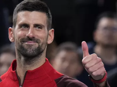 Novak Djokovic of Serbia gestures to his supporters after defeating Flavio Cobolli of Italy in the men's singles third round match of the Shanghai Masters tennis tournament at Qizhong Forest Sports City Tennis Center in Shanghai, China, Tuesday, Oct. 8, 2024. (AP Photo/Andy Wong)