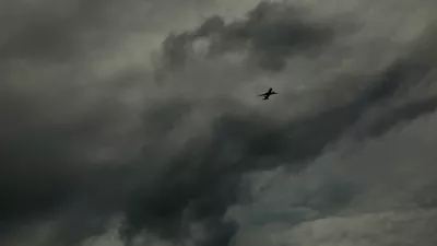 A plane flies before the arrival of Hurricane Milton, in Orlando, Florida, U.S. October 8, 2024. REUTERS/Jose Luis Gonzalez