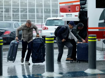 Passengers arrive at the airport as flights are delayed because of high winds from Storm Kirk, at Bilbao Airport in Loiu, Spain, October 9, 2024. REUTERS/Vincent West