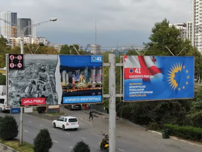 A drone view shows election billboards of the ruling Georgian Dream party, one of which depicts a devastated Ukrainian city contrasted against a peaceful Georgian one, in Tbilisi, Georgia September 27, 2024. REUTERS/Irakli Gedenidze