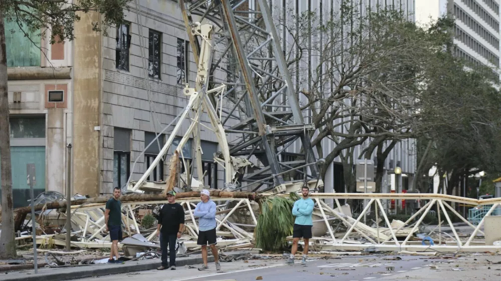 A construction crane fell over into an office building that houses the Tampa Bay Times headquarters, after Hurricane Milton, Thursday, Oct. 10, 2024. (Tampa Bay Times via AP)