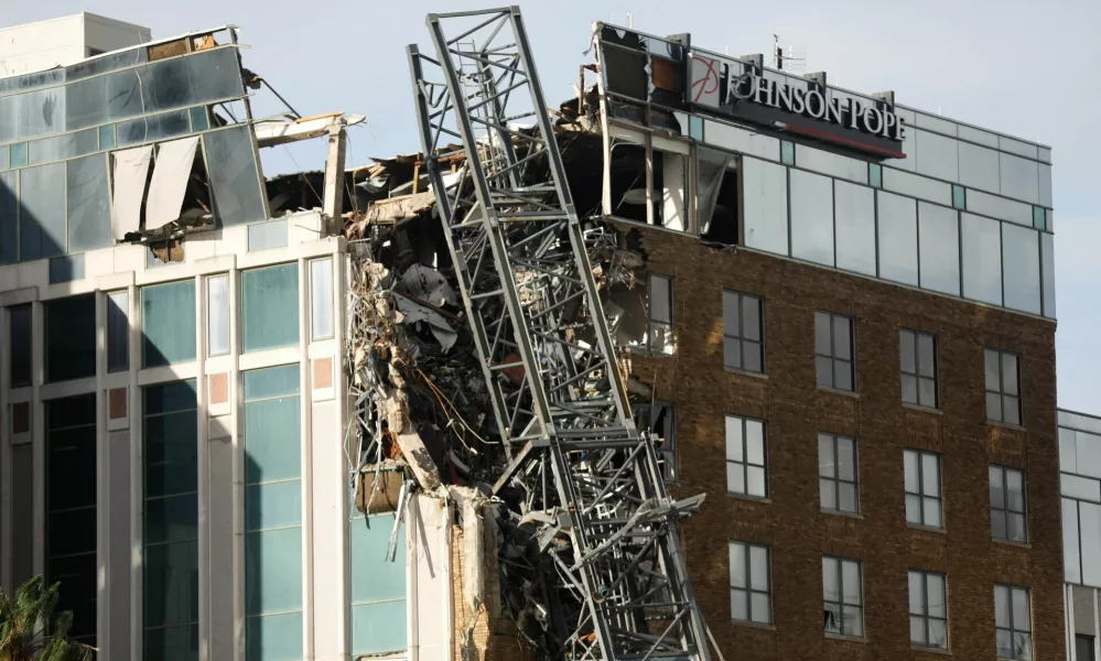 A view shows a collapsed construction crane that fell on the building that also hosts the offices of the Tampa Bay Times, after Hurricane Milton made landfall, in downtown St. Petersburg, Florida, U.S. October 10, 2024. REUTERS/Octavio Jones