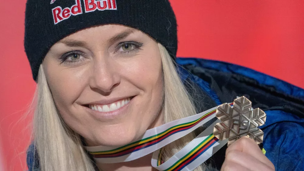 FILED - 10 February 2019, Sweden, Are: USA's Lindsey Vonn celebrates on the award ceremony with a bronze medal of the women's downhill race during the FIS Alpine World Ski Championships. Four-time alpine skiing World Cup champion Lindsey Vonn is considering a comeback in Beaver Creek in December, the Blick newspaper reported. Photo: Michael Kappeler/dpa