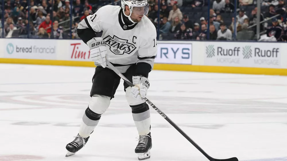 Dec 5, 2023; Columbus, Ohio, USA; Los Angeles Kings center Anze Kopitar (11) carries the puck as he enters the zone against the Columbus Blue Jackets during overtime at Nationwide Arena. Mandatory Credit: Russell LaBounty-USA TODAY Sports