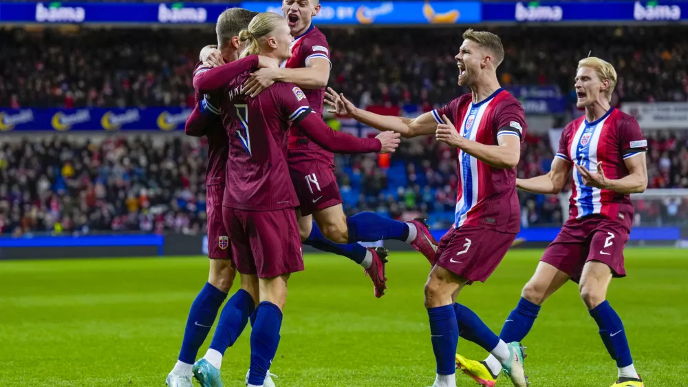 Norway's Erling Haaland, left, celebrates with teammates after scoring during the Nations League soccer match between Norway and Slovenia at Ullevaal Stadium, Thursday, Oct. 10, 2024, in Oslo, Norway. (Fredrik Varfjell/NTB Scanpix via AP)