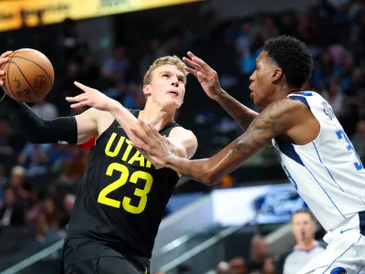 Oct 10, 2024; Dallas, Texas, USA; Utah Jazz forward Lauri Markkanen (23) drives to the basket as Dallas Mavericks center Jamarion Sharp (33) defends during the second half at American Airlines Center. Mandatory Credit: Kevin Jairaj-Imagn Images