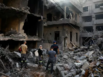 People inspect the site of an Israeli air strike, amid ongoing hostilities between Hezbollah and Israeli forces, in Beirut, Lebanon, October 11, 2024. REUTERS/Louisa Gouliamaki