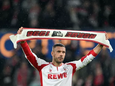 10 October 2024, North Rhine-Westphalia, Cologne: German footballer Lukas Podolski celebrates with the fans during the Lukas Podolski's farewell match. Photo: Federico Gambarini/dpa