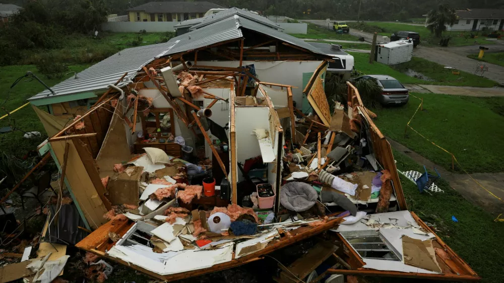 A property damaged after Hurricane Milton made landfall, in Lakewood Park, near Fort Pierce, in St. Lucie County, Florida, U.S., October 10, 2024. REUTERS/Jose Luis Gonzalez   TPX IMAGES OF THE DAY