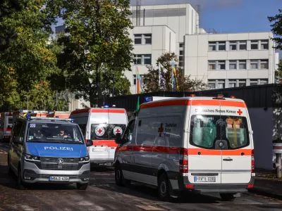 11 October 2024, North Rhine-Westphalia, Cologne: Ambulances wait outside the LVR clinic to transfer patients. A bomb from the Second World War is to be defused in Cologne on 11 October. Around 6,400 residents will have to leave their homes. According to the city, it is the most extensive evacuation of this kind in Cologne since 1945. Photo: Oliver Berg/dpa