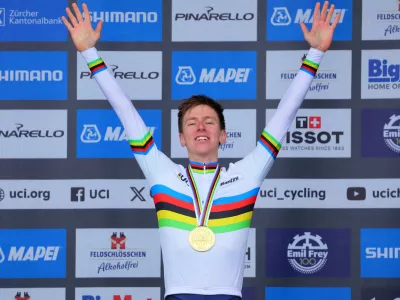 Cycling - UCI World Championships 2024 - Men's Elite Road Race - Zurich, Switzerland - September 29, 2024 Gold medallist Slovenia's Tadej Pogacar celebrates on the podium REUTERS/Denis Balibouse