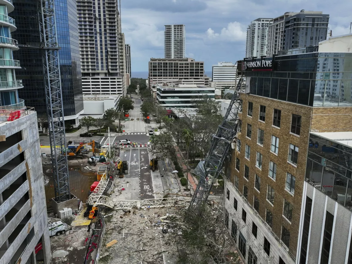 An aerial drone view of the scene where a downtown high-rise was smashed by a fallen crane from Hurricane Milton at 490 1st Avenue South, Friday, Oct. 11, 2024 in St. Petersburg, Fla. The building damaged by Hurricane Milton is home to the Tampa Bay Times, a law firm, a defense contractor and more. (Dirk Shadd/Tampa Bay Times via AP)