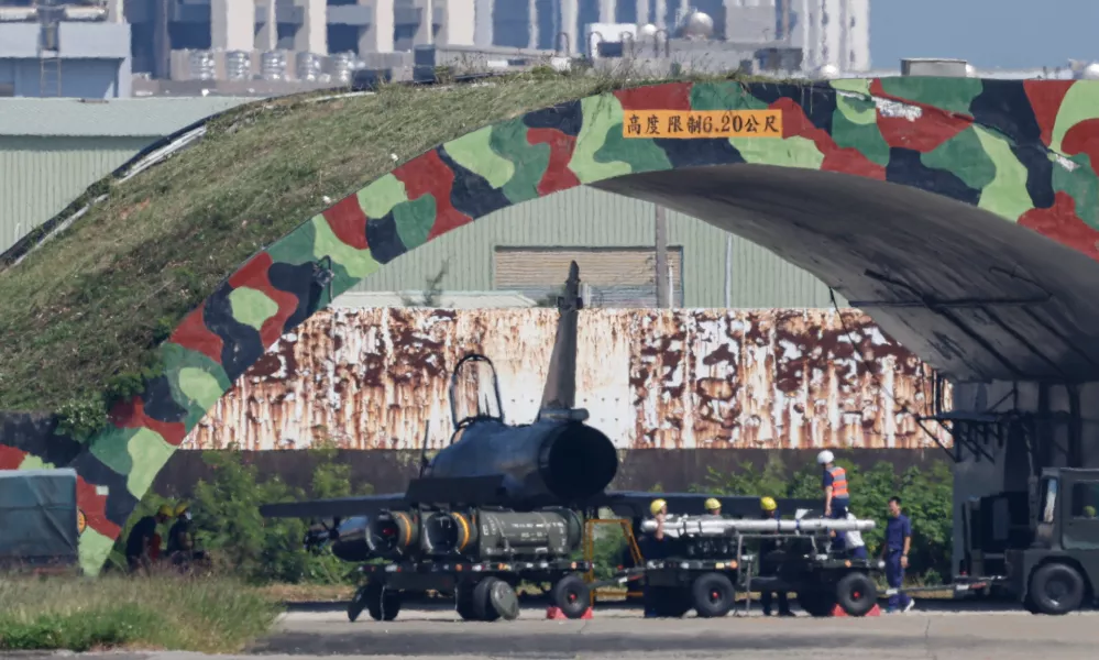 A transport vehicle carrying missiles and various munitions is seen at Hsinchu Air Base in Hsinchu, Taiwan October 14, 2024. REUTERS/Tyrone Siu