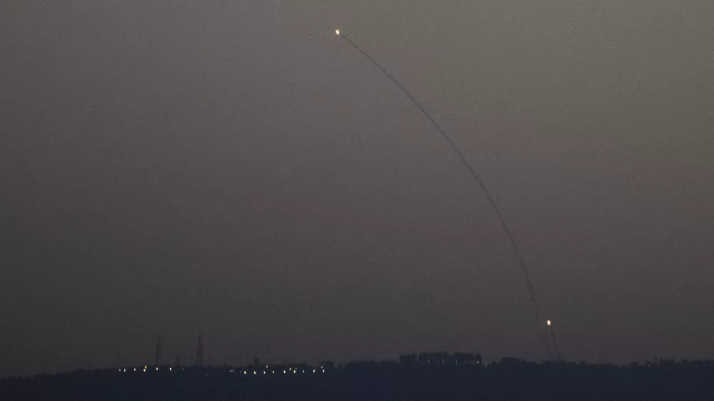 Israeli Iron Dome air defense system fires to intercept rockets that were launched from Lebanon, in northern Israel, Monday, Oct. 14, 2024. (AP Photo/Leo Correa)