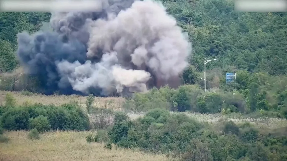 Smoke rises after North Korea blows up sections of inter-Korean roads on its side of the border between the two Koreas, according to South Korea's military, as seen from the South Korean side, October 15, 2024, in this screen grab from a handout video. South Korean Defence Ministry/Handout via REUTERS  THIS IMAGE HAS BEEN SUPPLIED BY A THIRD PARTY. STILL IMAGE TAKEN FROM VIDEO BLURRED AT SOURCE