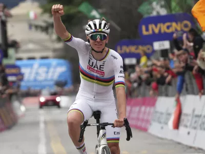 Reigning World Champion Slovenia's Tadej Pogacar celebrates winning Il Lombardia, Tour of Lombardy cycling race, in Como, Italy, Saturday, Oct. 12, 2024. (Gian Mattia D'Alberto/LaPresse via AP)