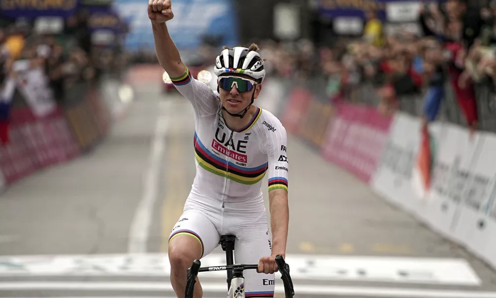 Reigning World Champion Slovenia's Tadej Pogacar celebrates winning Il Lombardia, Tour of Lombardy cycling race, in Como, Italy, Saturday, Oct. 12, 2024. (Marco Alpozzi/LaPresse via AP)