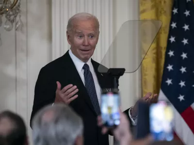 President Joe Biden makes a joke at a reception marking Italian-American Heritage Month, in the East Room of the White House in Washington, Wednesday, Oct. 16, 2024. (AP Photo/Ben Curtis)