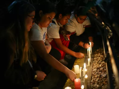 Fans place candles outside the hotel where Liam Payne, former One Direction member, was found dead, in Buenos Aires, Argentina, October 16, 2024. REUTERS/Agustin Marcarian