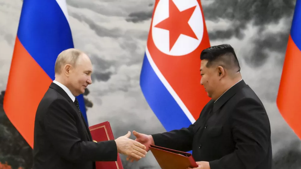 FILE - Russian President Vladimir Putin, left, and North Korea's leader Kim Jong Un exchange documents during a signing ceremony of the new partnership in Pyongyang, North Korea, on June 19, 2024. (Kristina Kormilitsyna, Sputnik, Kremlin Pool Photo via AP, File)