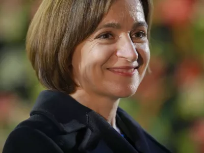 Moldova's President Maia Sandu smiles during an electoral meeting in Magdacesti, Moldova, Thursday, Oct. 17, 2024, as she seeks a second term in office ahead of a presidential election and a referendum on whether to enshrine in Moldova's Constitution its path to European Union membership, that will take place on Oct. 20. (AP Photo/Vadim Ghirda)