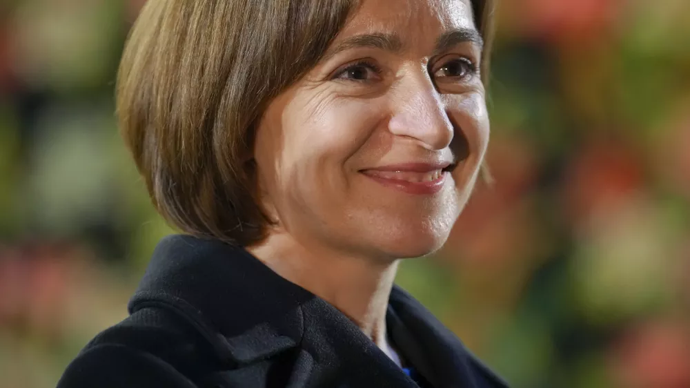 Moldova's President Maia Sandu smiles during an electoral meeting in Magdacesti, Moldova, Thursday, Oct. 17, 2024, as she seeks a second term in office ahead of a presidential election and a referendum on whether to enshrine in Moldova's Constitution its path to European Union membership, that will take place on Oct. 20. (AP Photo/Vadim Ghirda)