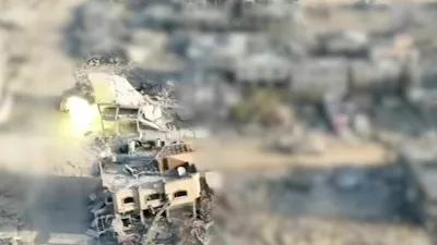 A view shows an explosion in a building, which the Israeli army says is a tank firing at a building where Hamas leader Yahya Sinwar was present, in Tal As-Sultan, Rafah Governorate, southern Gaza in this screengrab obtained from a handout video released on October 18, 2024. Israel Defense Forces/Handout via REUTERS  THIS IMAGE HAS BEEN SUPPLIED BY A THIRD PARTY. BLURRED FROM SOURCE.